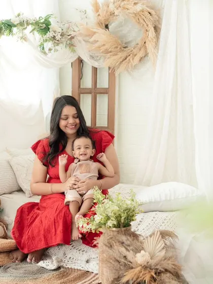 A mother and her baby sharing a happy moment. Our boho setup with its soft, diffused light is perfect for capturing these gentle and loving interactions.