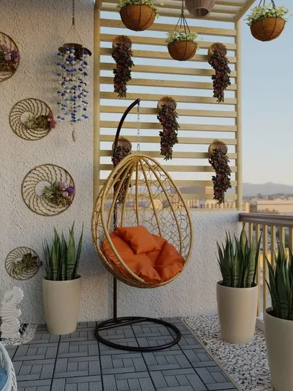 This bohemian-inspired balcony uses a mix of textures and natural materials. An orange-cushioned egg swing provides a comfortable focal point, while wall decor and snake plants in minimalist pots complete the chic, relaxed vibe.