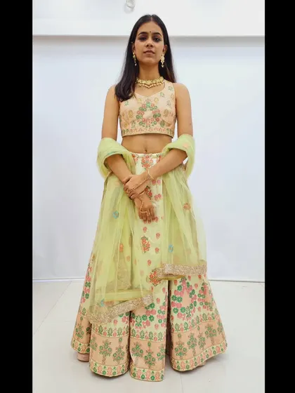 A duplicate of 228, a full view of the pastel green lehenga.