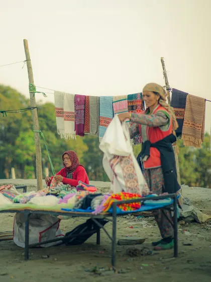 Local women selling hand-woven shawls at Jalori Pass. Documenting local life and commerce is a key part of my travel storytelling.
