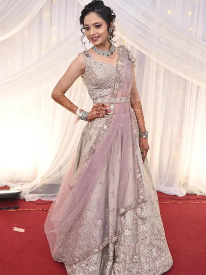 Another angle of the client in the same lehenga, highlighting the detailed work.