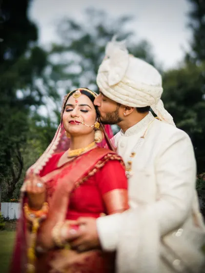 A moment of pure bliss. The groom's kiss is a tender end to the ceremony for Aditya and Aditi.
