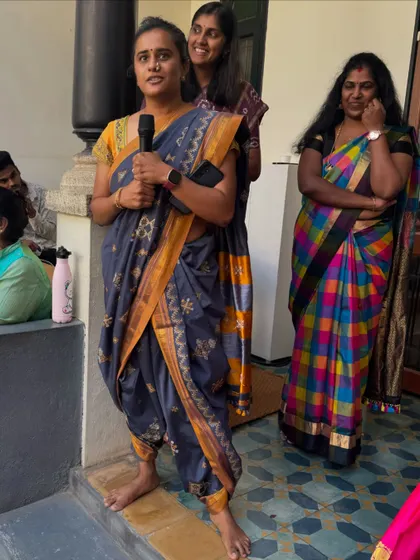 A parent shares a few words during our celebration. We value the active participation of our parent community in making these events meaningful and memorable.