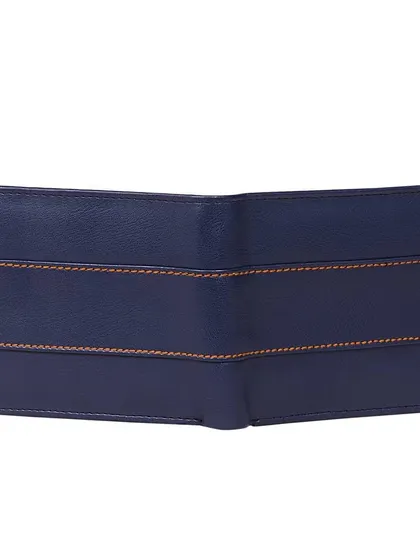 The back view of the navy blue leather wallet, showcasing the continuation of the clean lines and contrast stitching. The bifold design remains slim and easy to fit in a pocket.