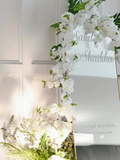 A personalized mirror with a sweet message, part of the welcome decor for the wedding.