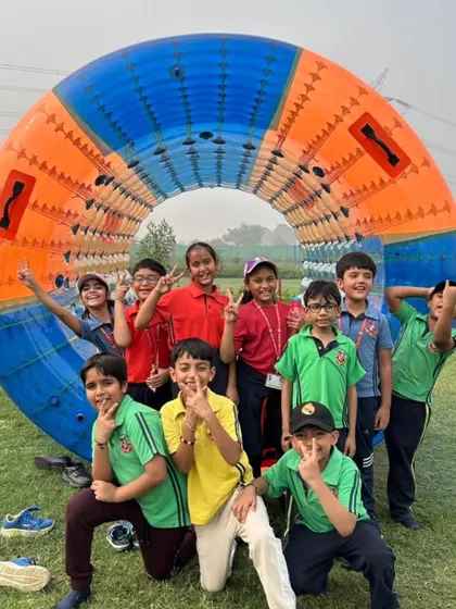 A group of happy campers poses with the Zorbing Roller. Activities like these are not just fun but also promote cooperation and create lasting bonds among students.