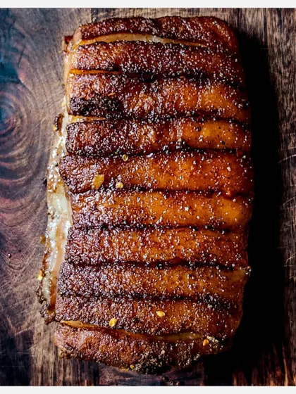 A beautifully grilled rack of my herb-crusted pork ribs, showcasing the crispy skin.