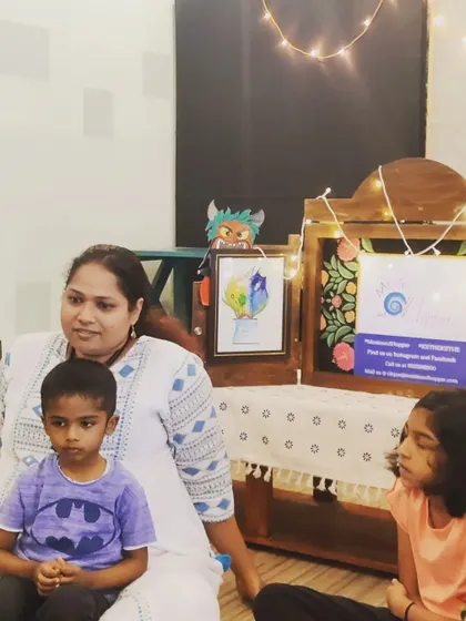 A close-up of the kids' focused faces as they watch the Kamishibai story unfold. The combination of visuals and narration is captivating for young minds.