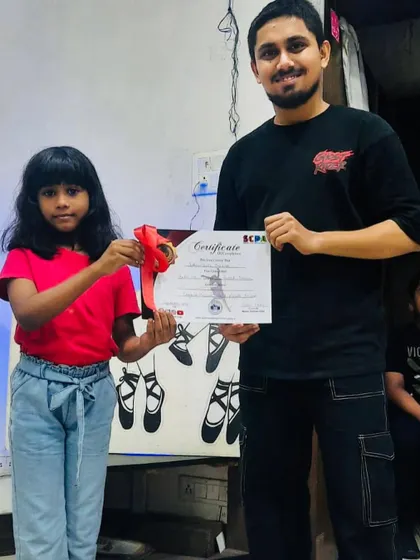 Students of all ages receiving their achievement certificates. My programs are structured to provide a clear path of progression for every dancer.