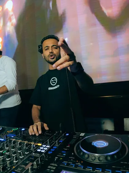Pointing to the crowd while mixing at Vagalume Goa. It's about being present and connected.