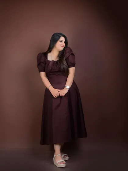 A candid-style shot looking away from the camera. This adds a touch of grace and thoughtfulness to a matrimonial portfolio.