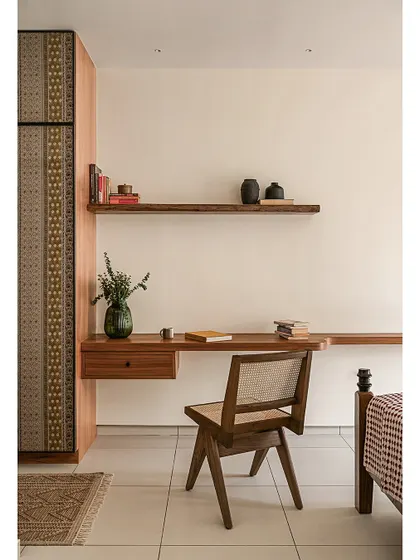 A wider view of the bedroom in 'Kayu', showing the floating study desk and cane chair. The design focuses on clean lines and natural materials, creating a functional workspace that doesn't compromise the room's tranquil, minimal feel.