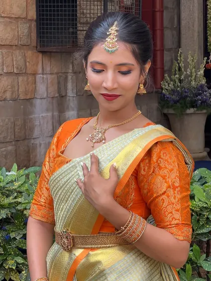 A graceful pose that highlights the soft, romantic makeup. The focus is on flawless skin and a subtle glow, a look that is always in high demand.