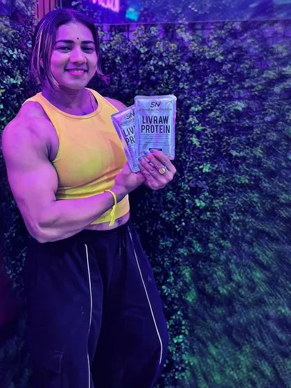 Standing proud with my go-to protein source. Proper nutrition is the foundation of a champion's physique.