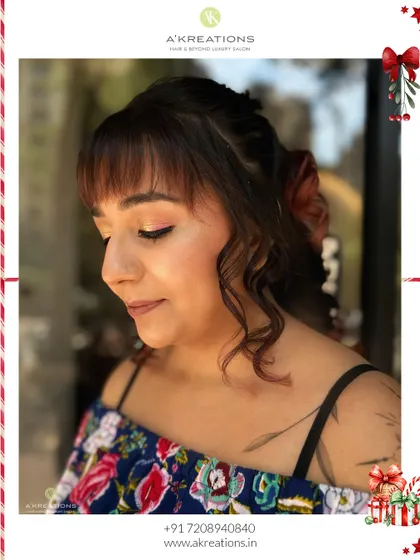 A soft and pretty Christmas party look. We used pink tones on the eyes and lips and styled the hair with a modern fringe and colorful curls.