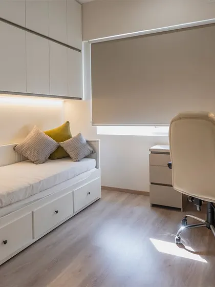 The daybed in this multi-use room features convenient pull-out drawers for extra storage, making it a practical choice for guest rooms or kids' rooms.
