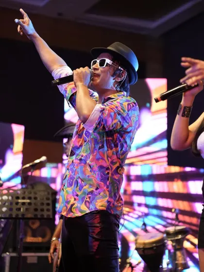Pointing to the crowd, getting them to sing along. A performance is a two-way street, and I love it when the audience gives the energy right back to us.