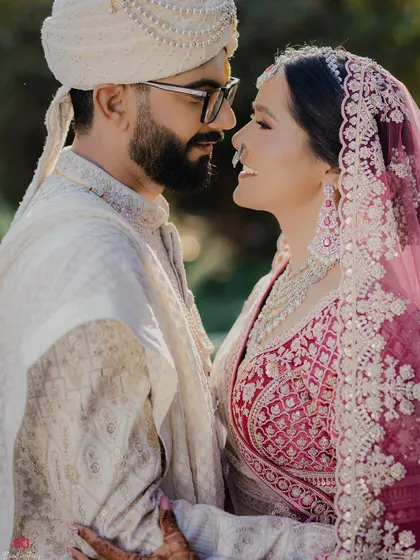 A beautiful close-up portrait of the couple on their wedding day, capturing their loving gaze and deep connection.