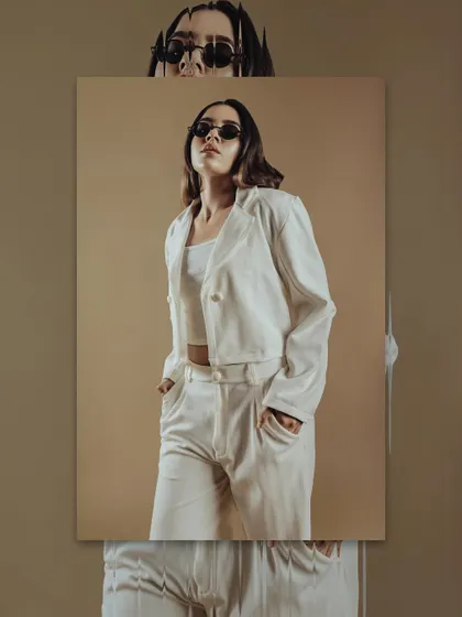 A confident pose from the same editorial. The makeup contributes to the overall mood and power of the image.