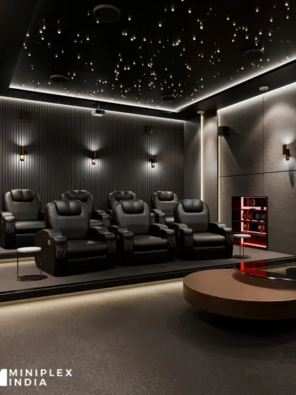 Another angle of the 'Celestial Escape' theater, showing the tiered seating arrangement and a built-in bar nook. It’s a space designed for both premium entertainment and hosting guests in style.