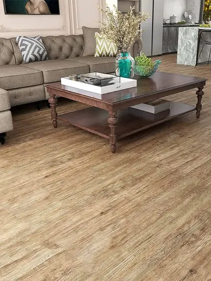 This light oak style flooring is perfect for an open-plan living area. Its subtle grain and neutral color provide a versatile base that complements the modern furniture and open kitchen concept.