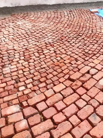We often use traditional techniques like Brickbat Coba for waterproofing. This time-tested method provides excellent waterproofing and thermal insulation for flat roofs. It's a labor-intensive process, but we believe it offers the best long-term solution.