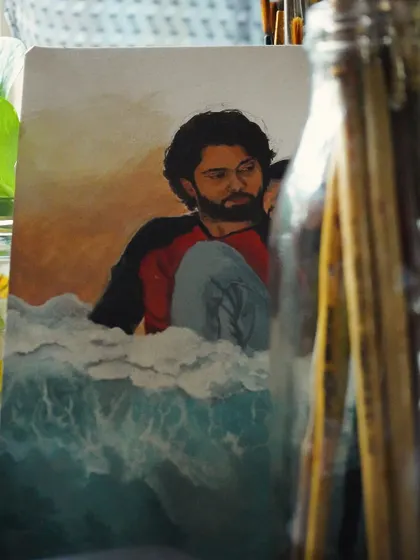 A different angle of the Sapta Saagaradaache Ello painting, with my paint brushes in the foreground.