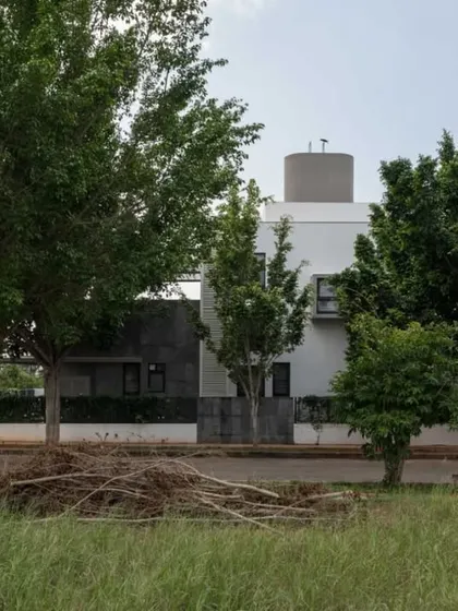 A wider view of the DUBEY Home, showing how it is situated among the trees of the neighborhood. Our design process always begins with a careful study of the site and its existing natural elements.