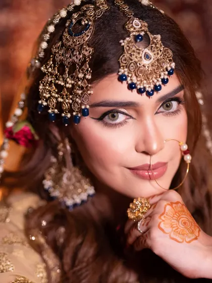 Timeless beauty meets modern glam. This Heeramandi-inspired look features a sharp winged liner and glowing skin, a perfect fusion of classic and contemporary artistry.