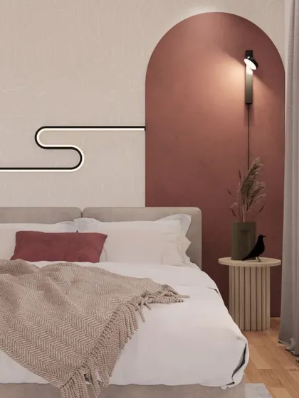 The 'Dusty Rose Desert' bedroom, where a painted arch in a warm rose tone creates a beautiful focal point behind the bed.