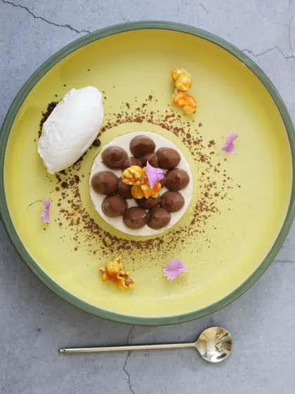 A delicate dessert from my four-course lunch fix, beautifully plated with ice cream and popcorn.