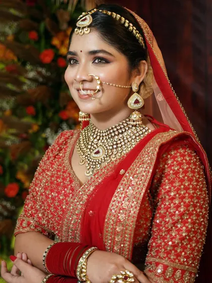 A side profile of the bride, showcasing her beautiful jewelry and the elegant, timeless makeup look.