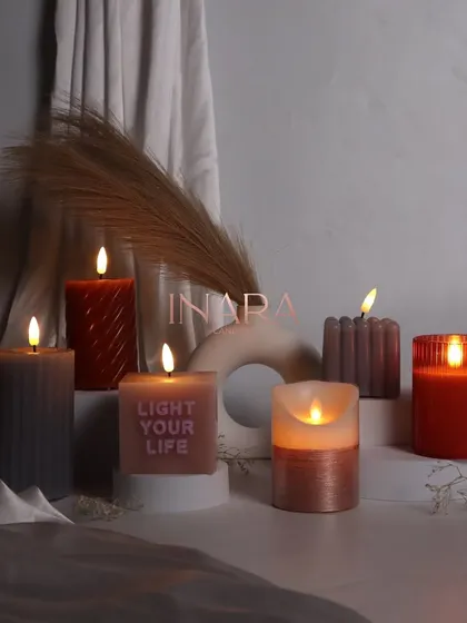 A moodier shot of our new pillar and battery-operated candle collection. The warm glow highlights the beautiful textures and modern designs, perfect for creating a sophisticated ambiance.