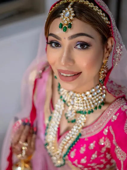 A perfect close-up of the holographic eye makeup and flawless skin. This look is modern, fun, and totally bridal.