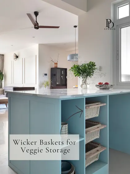 Wicker baskets integrated into the kitchen island provide breathable storage for vegetables like onions and potatoes. This adds an earthy, natural texture while being incredibly practical.