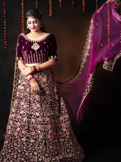 This luxurious velvet lehenga with intricate embroidery is a stunning choice for a bridal look or a grand pre-wedding photoshoot.