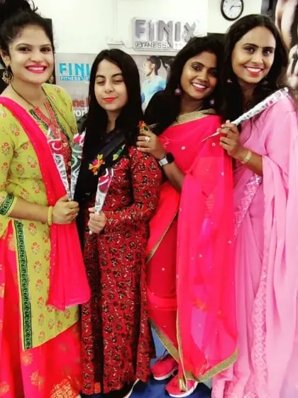 A group of smiling faces at our Women's Day celebration. The joy and positivity in our studio are what make us unique.