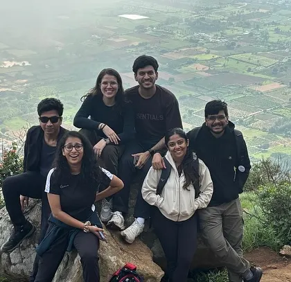 A group enjoying the view from the top during our Skandagiri sunrise trek. It's an early start but the view is totally worth it.