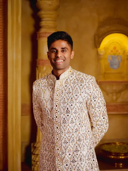 A closer portrait of Suryakumar Yadav. His smile shows the confidence that comes from wearing a perfectly crafted, bespoke piece of Indian couture.
