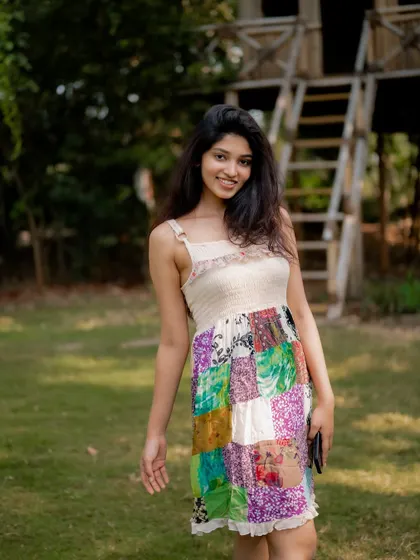 A candid and joyful portrait of actress Rachana Inder in a park. The natural setting and her happy expression create a beautiful and authentic shot.