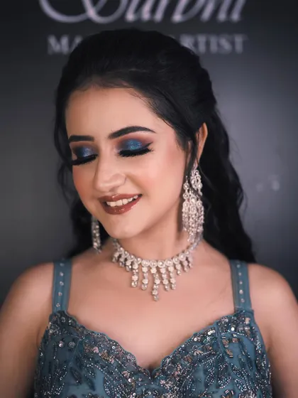 A close-up of the engagement bride's stunning makeup. The bold blue smokey eye is the star of the show, balanced by a flawless base and a soft lip color.