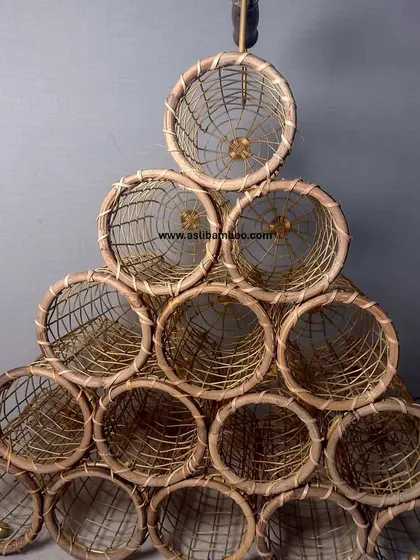Our handcrafted rattan and cane wine rack is a stylish and functional way to store and display your collection. This 15-bottle pyramid stack is a conversation piece, perfect for home bars or as a unique corporate gift.