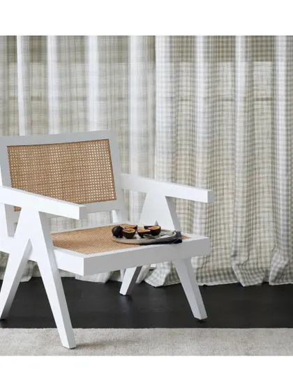 The 'Apollo' collection of patterned sheers is perfect for creating a relaxed and tranquil Hamptons aesthetic. The subtle check pattern adds a touch of classic, coastal charm to this bright space.