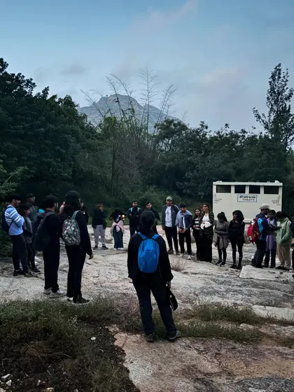 An instructor briefing the college group at the start of the trail. Every trek begins with a focus on safety, objectives, and teamwork.