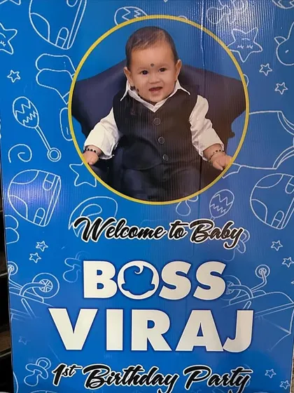 A close-up of a personalized 'Boss Baby' welcome sign. I can customize these signs with your child's photo and name to match any theme.
