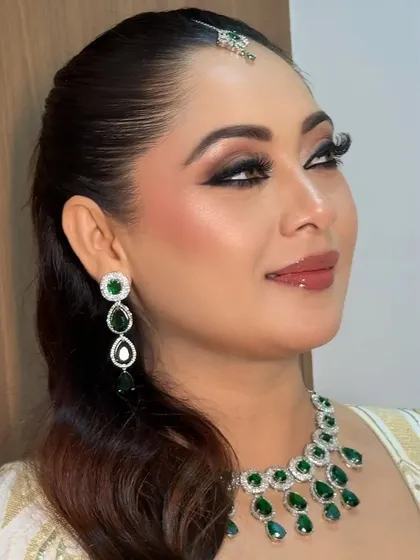 The finished look for Razia's Nikkah ceremony. Her eyes are beautifully defined with kohl and winged liner, paired with dewy skin and a soft blush.