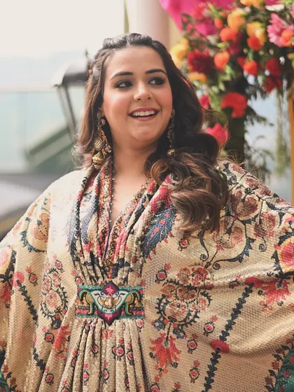 A close-up of the bride's beautiful printed kaftan by Rajdeep Ranawat. We chose this unique silhouette for a timeless look she can restyle later.