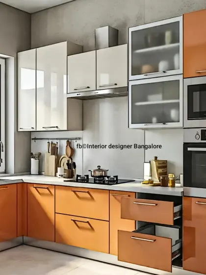 This L-shaped kitchen makes a statement with vibrant orange cabinets. Paired with glossy white upper cabinets and frosted glass, the design is energetic and functional, featuring deep drawers for easy storage.