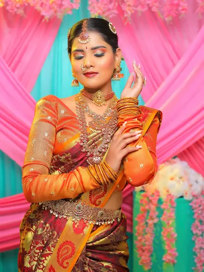 A beautiful bride showcasing a layered temple jewellery set. The intricate details on the choker, haram, and waist belt create a cohesive and stunning look.