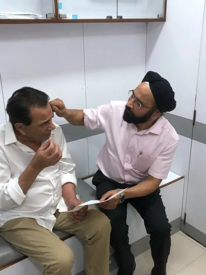 A proper diagnosis is the most critical first step. Here, I am conducting a detailed hair and scalp examination for the legendary actor Dharmendra. Before recommending any treatment, surgical or non-surgical, I need to understand the precise cause of hair loss.